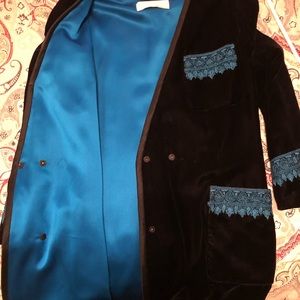 Vintage dress . Black velvet with aqua blue silk lining. Scroll stitching .